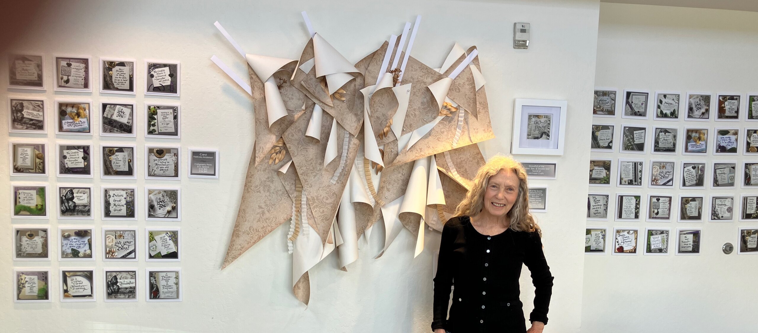 Carol in front of her exhibit