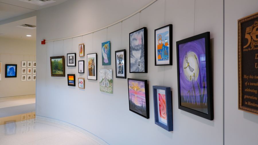 Artwork pieces on display on a wall