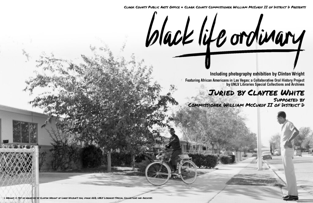 Black-and-white photo of a person in a wheelchair on a sidewalk, while another stands nearby. Large text reads “black life ordinary,” advertising a photography exhibition featuring African Americans in Las Vegas.
