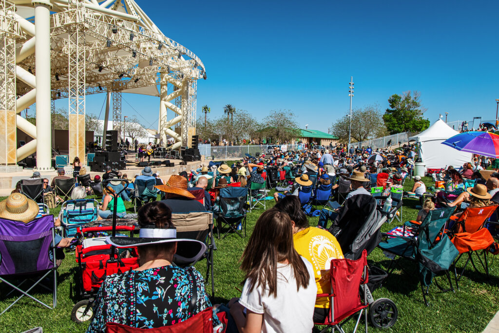 People enjoying the music at the Bluegrass Festival on the lawn in the Centennial Hills Amphitheatre