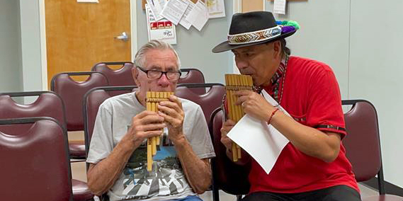 Carlos Ocampo teaches a student during a Creative Aging class.