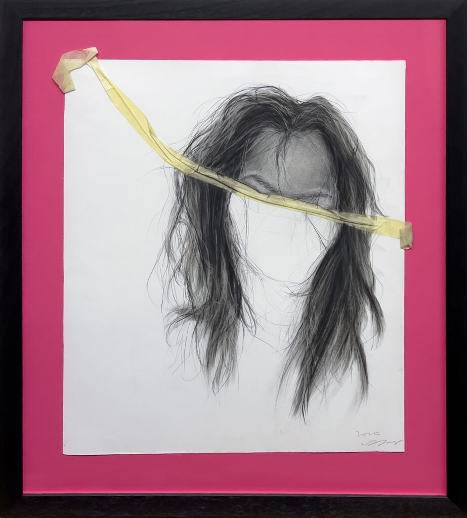 A framed artwork shows a realistic pencil drawing of long, messy hair with no visible face, taped to a magenta background with a strip of yellow tape across the upper left of the paper.