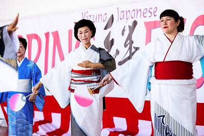 Performers in geisha outfits on stage at the Kizuna Japanese Fest.