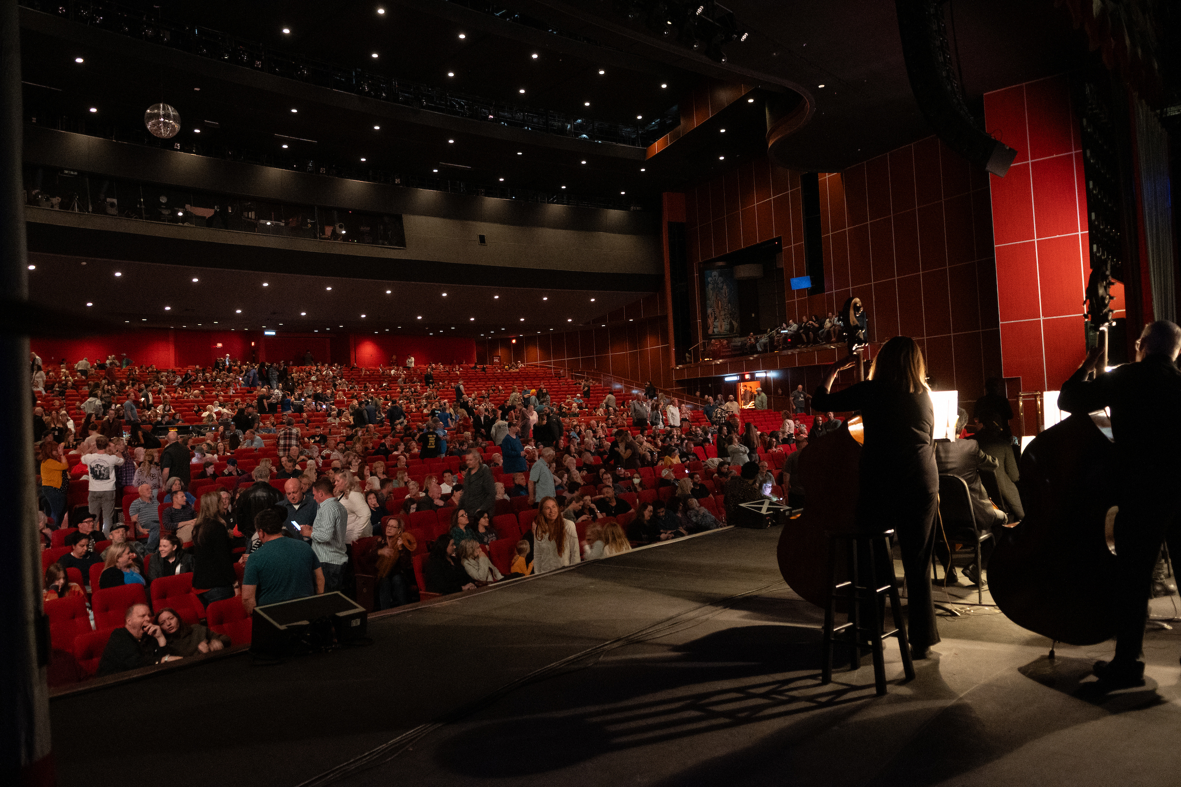A band plays on the Grand Theatre stage while the audience enjoys at the Grand Sierra Resort and Casino.