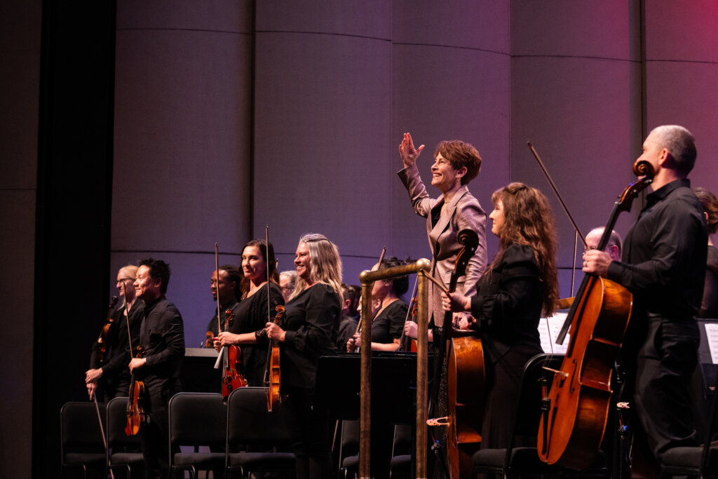 Conductor Laura Jackson and the Reno Phil stand for applause.