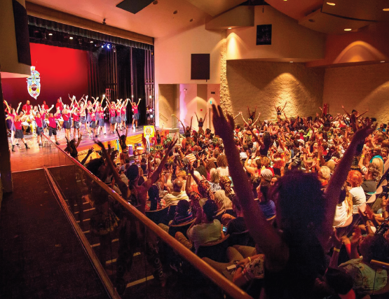 Audience cheering for people on stage.