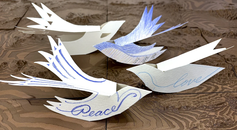 Paper birds decorated in blue designs
