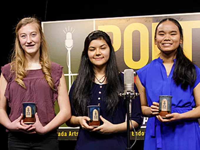 cowboy poetry a woman in cowboy clothing performs on the violin