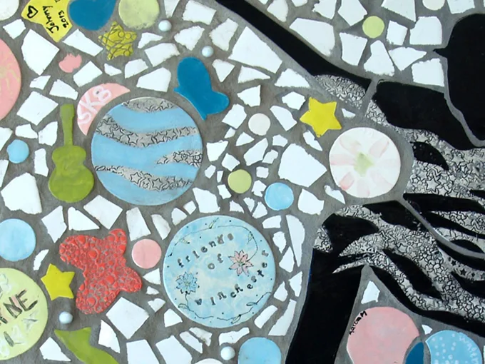 Colorful mosaic featuring circles with abstract patterns and images