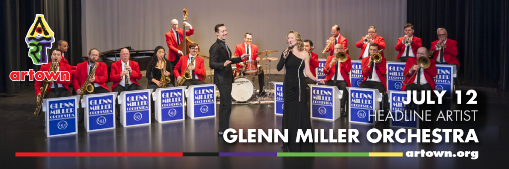 A big band in red jackets called the Glenn Miller Orchestra performs on stage with a female singer. The image promotes their show at Artown on July 12 as the headline artist.