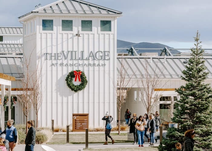 The Village at Rancharrah sign decorated for the holidays.